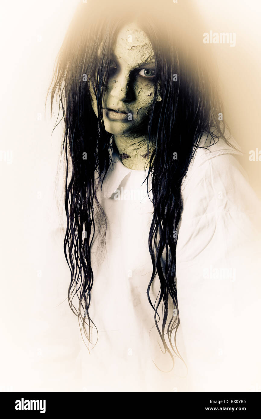 a scary ghost girl wearing a white nightie Stock Photo