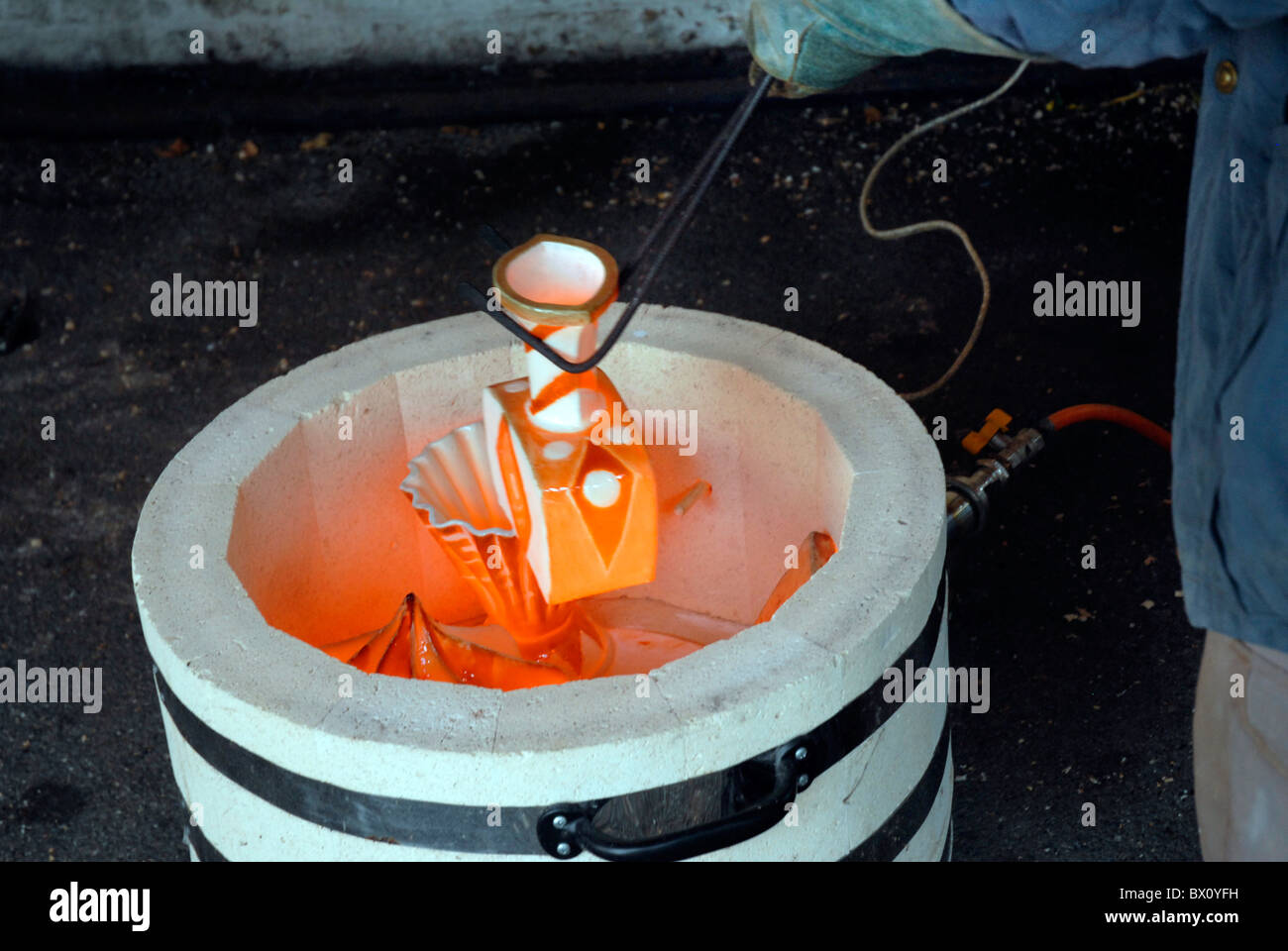 Making pottery using Raku a traditional meted of firing pottery Stock Photo Alamy