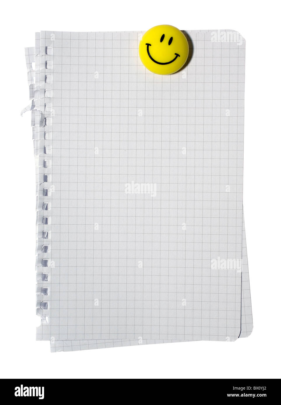 Stack of checked note paper and yellow smiling magnet isolated on white ...