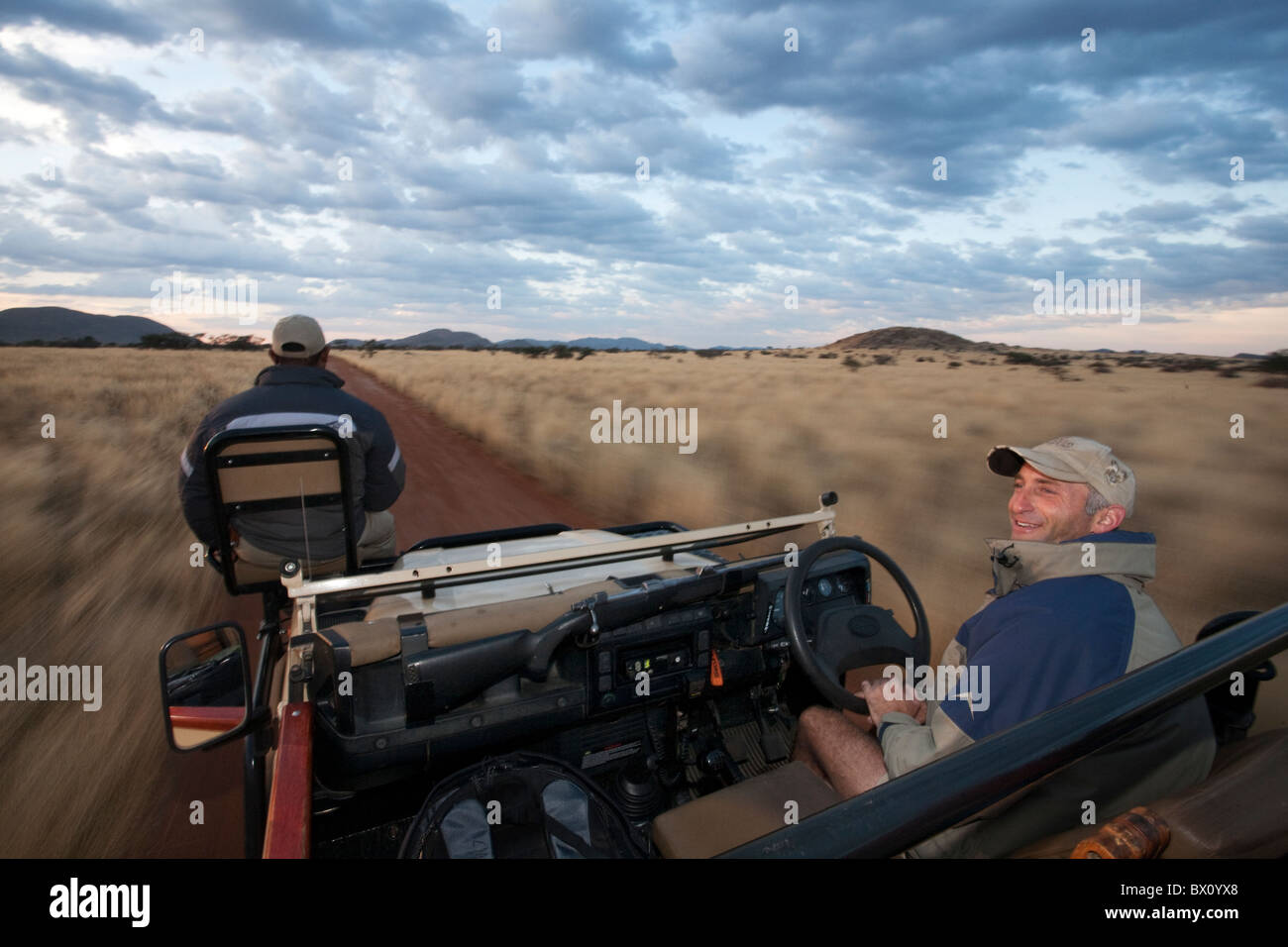 A game Ranger and guide drive through Tswalu in the Kalahari, South Africa’s largest Private Game Reserve. Stock Photo