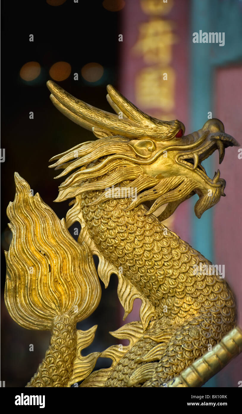 dragon keeping watch over incense shrine Stock Photo