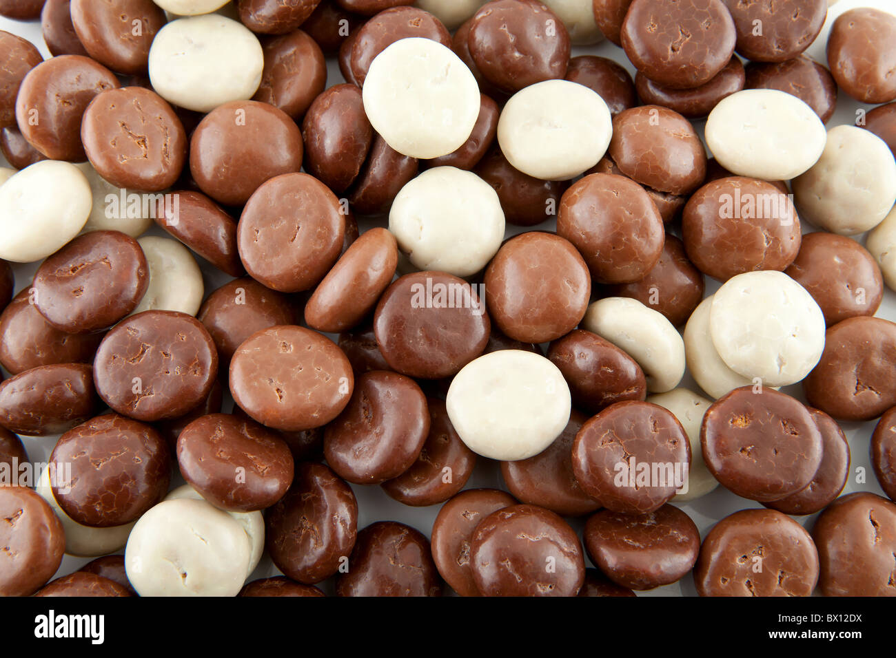 background of chocolate gingernuts, pepernoten, in closeup. Tyical Dutch candy for 5 december. Stock Photo
