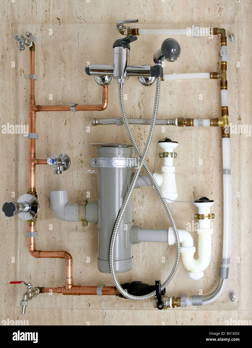 Plumber with copper and PVC pipes