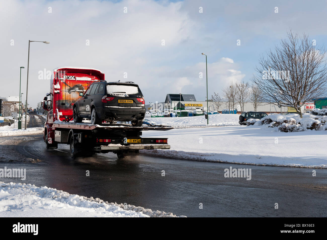Car being transported on back of a lorry. Stock Photo