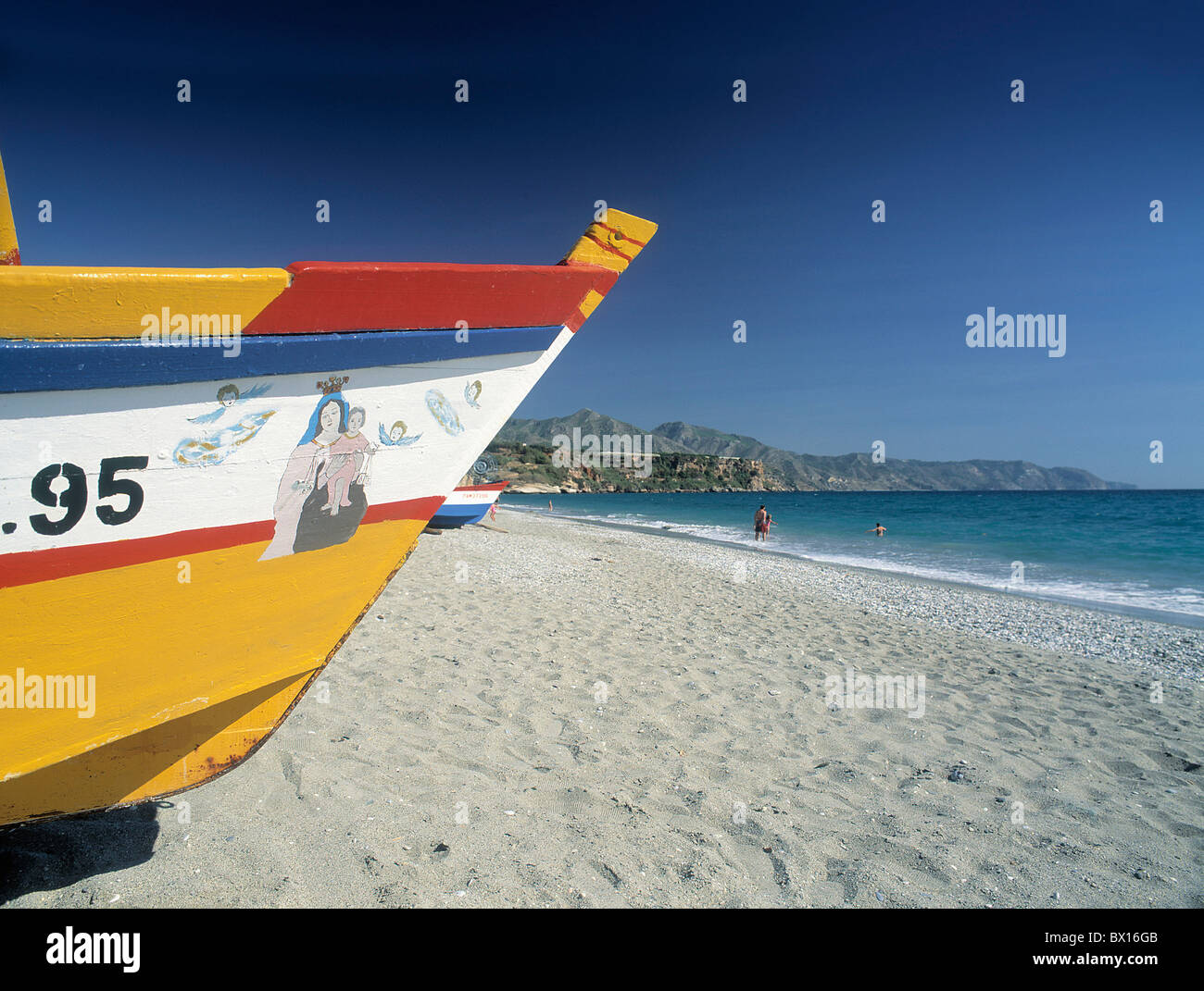 Andalusia beach Boat coast Costa del Sol fishing boat Nerja Playa Burriana sand beach sea seashore Spain Stock Photo