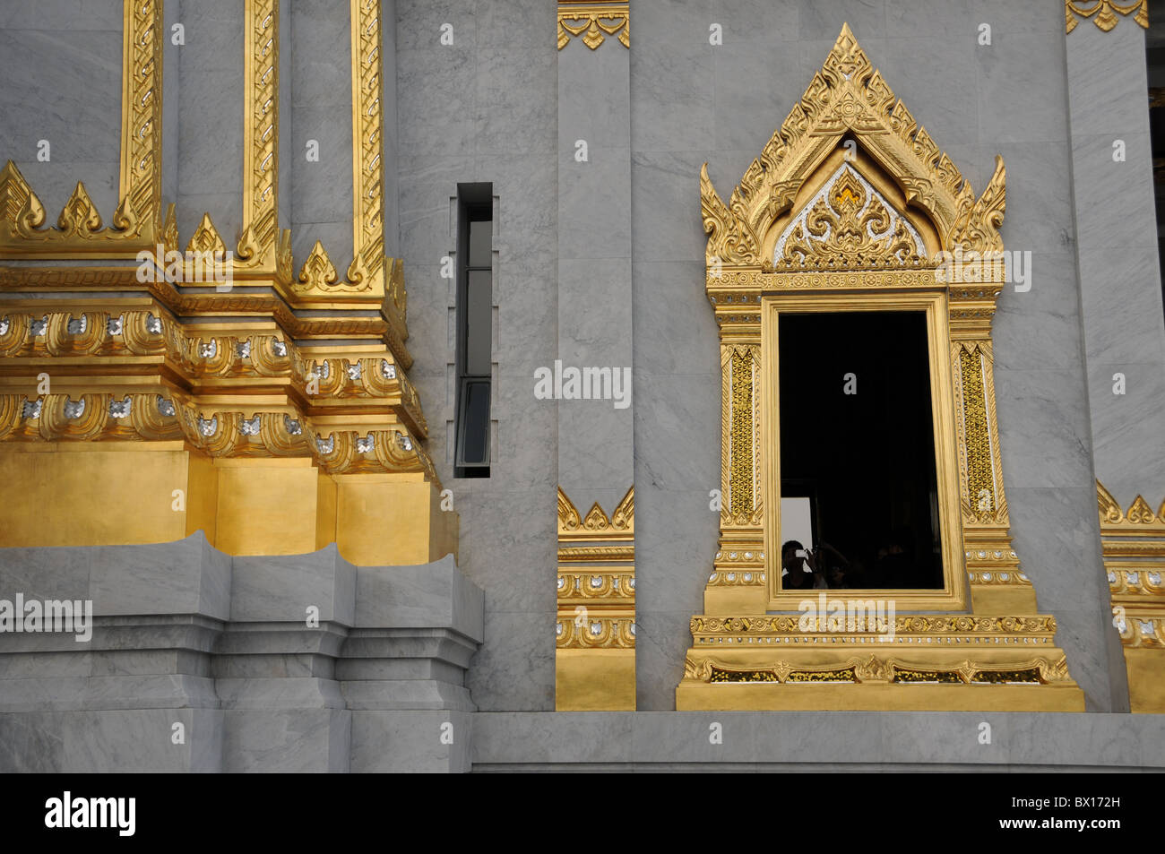 Artfull Wintow of Wat Traimit in Bangkok Stock Photo