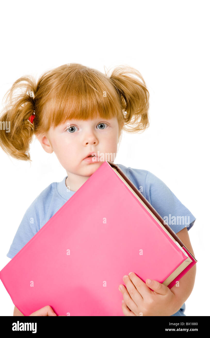 Portrait of small girl with textbook on a white background Stock Photo