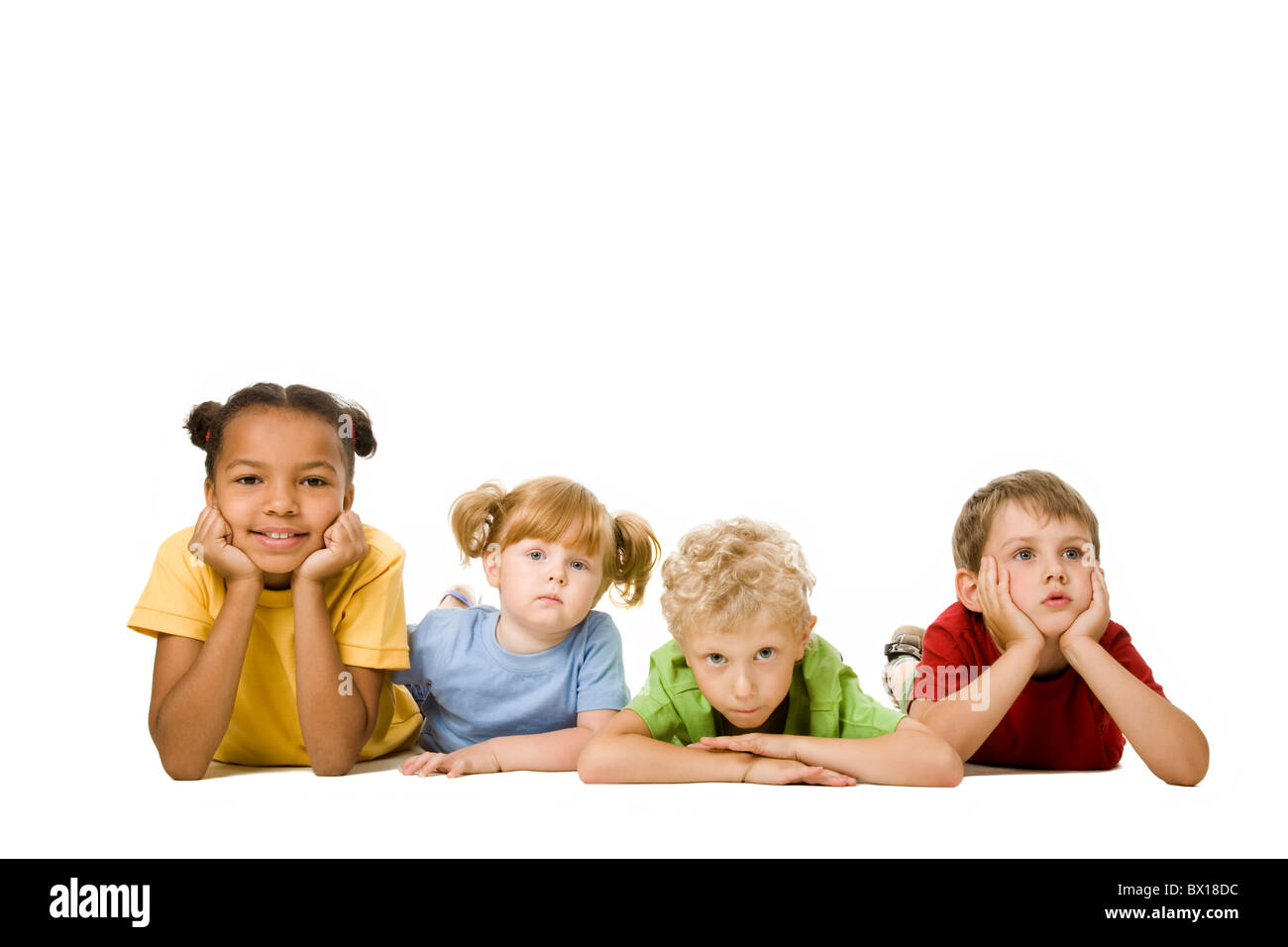 Portrait of four children lying in a line Stock Photo