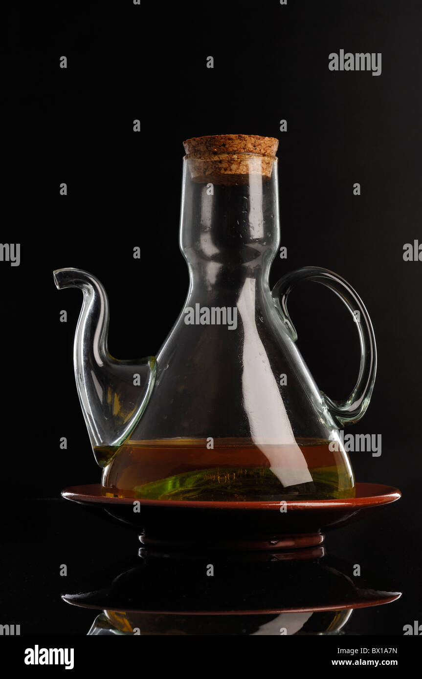 Oil cruet over black background Stock Photo Alamy