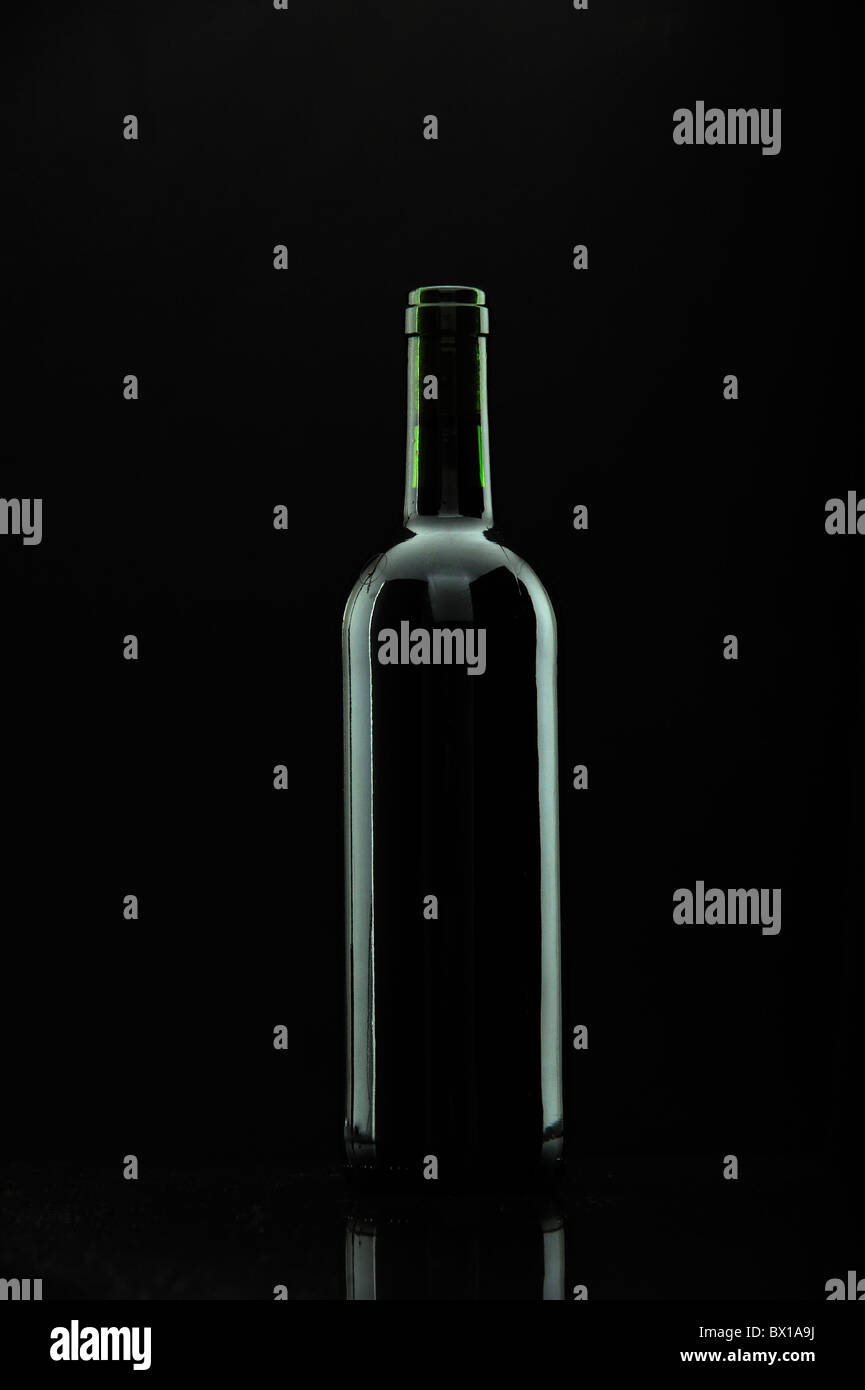 bottle of wine over black, reflexions. Stock Photo