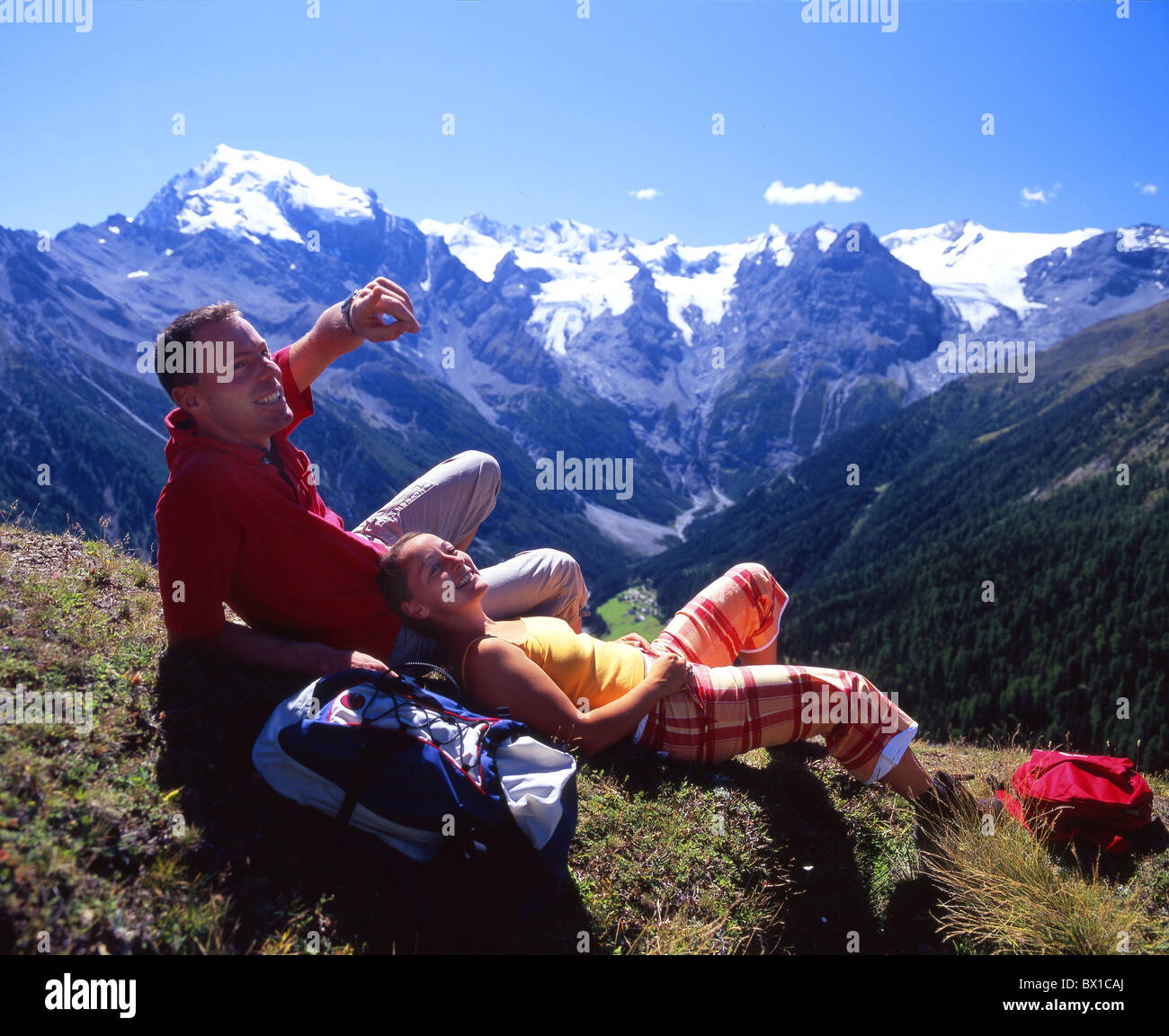 Hiking hiker couple relax rest mountains Alps rest mountain hiking scenery landscape Vinschgau Italy Euro Stock Photo