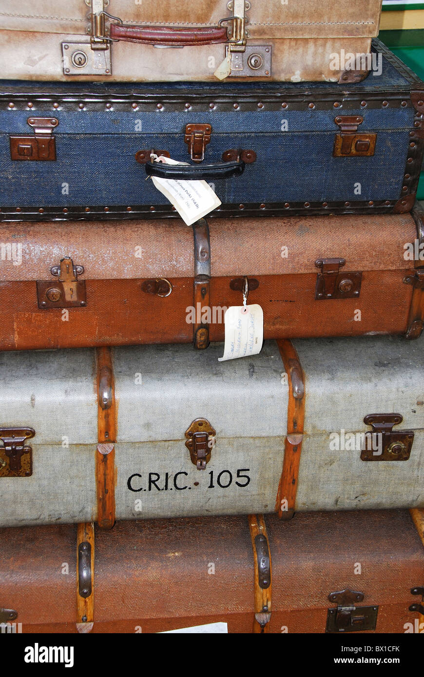 Pile of suitcases on railway platform Stock Photo