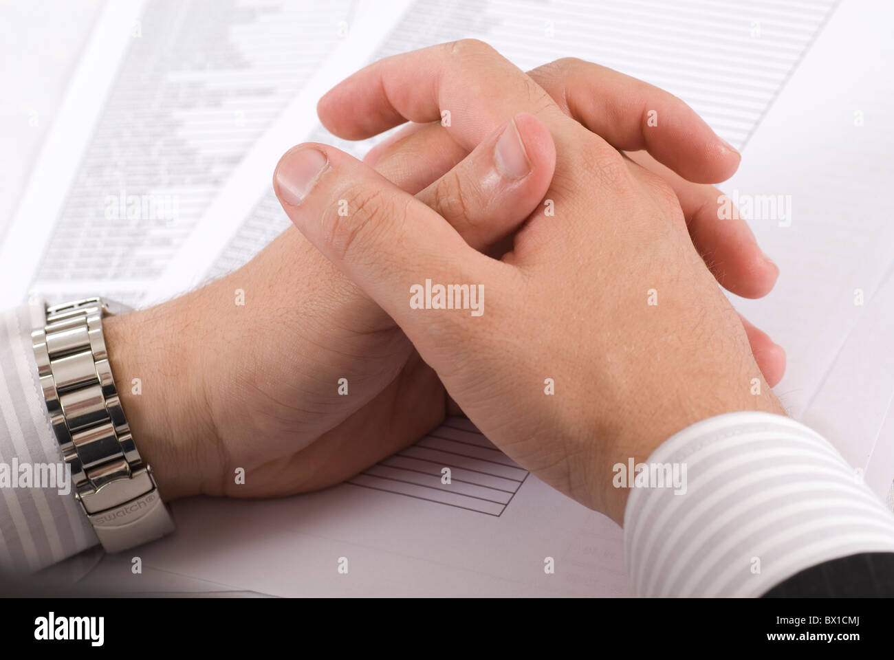 Hands of an executive business man over papers inside office Beirut Lebanon Middle East Stock Photo