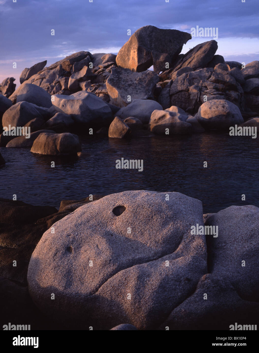 Face stone rock coast stone face sea humor amusing Corsica France Europe Stock Photo