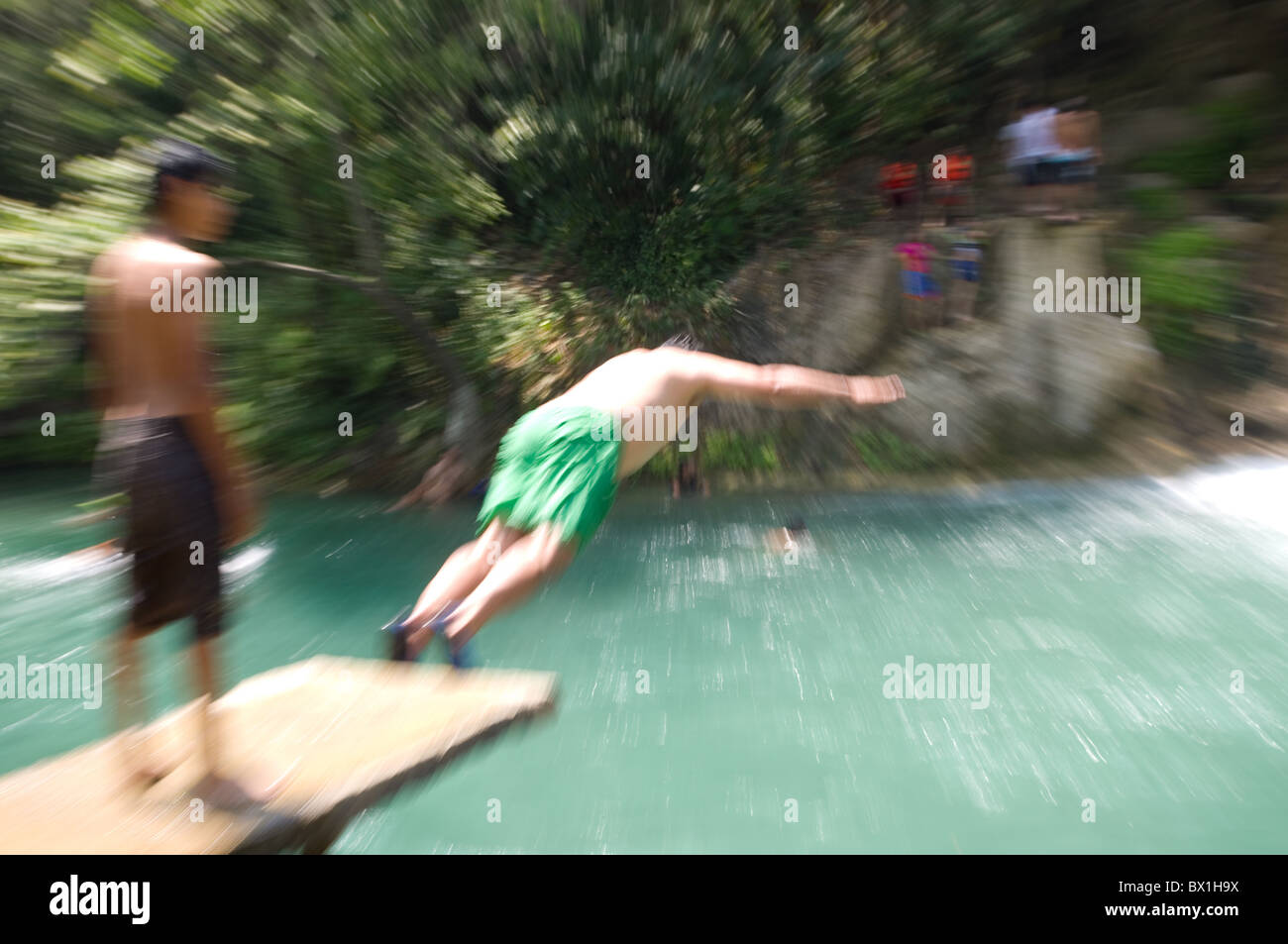 Fat Mexican kid diving at Tamasopo waterfalls Stock Photo Alamy