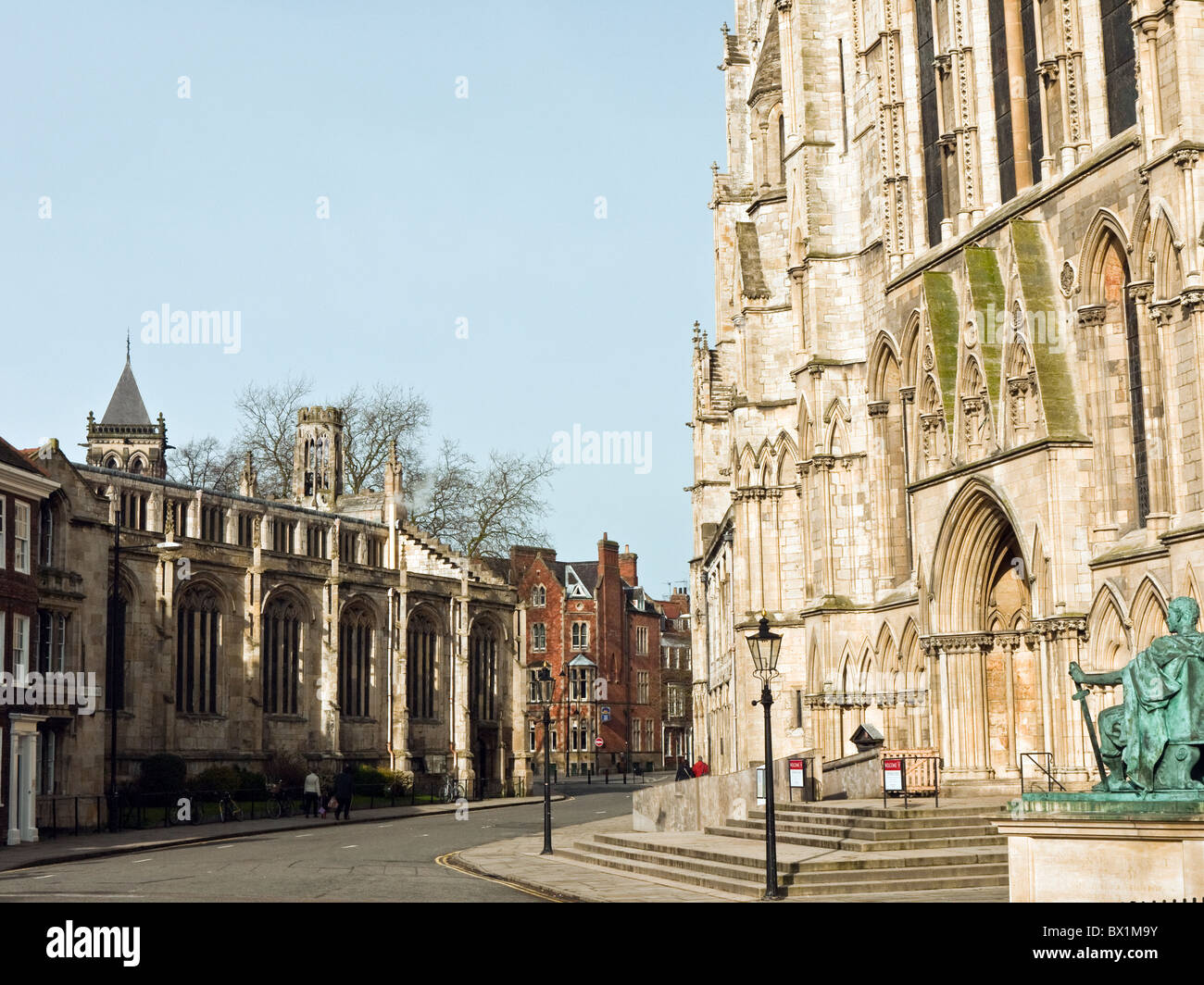 South entrance of York Minster with the Church of St Michael le Belfry - completed 1536 - opposite, City of York, Yorkshire, UK Stock Photo