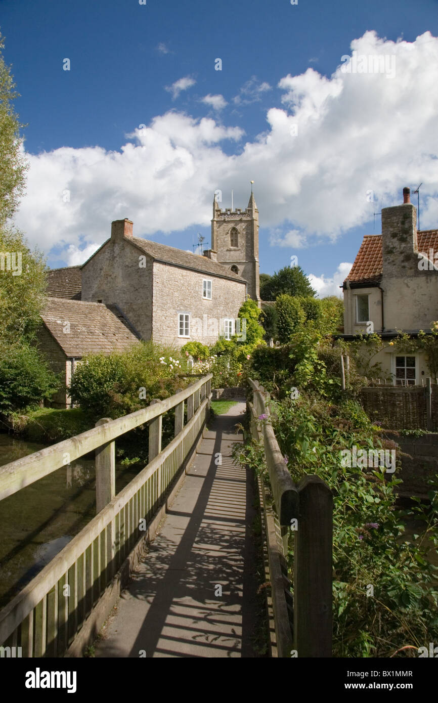 A view of the village of Nunney from the footbridge over the brook Stock Photo