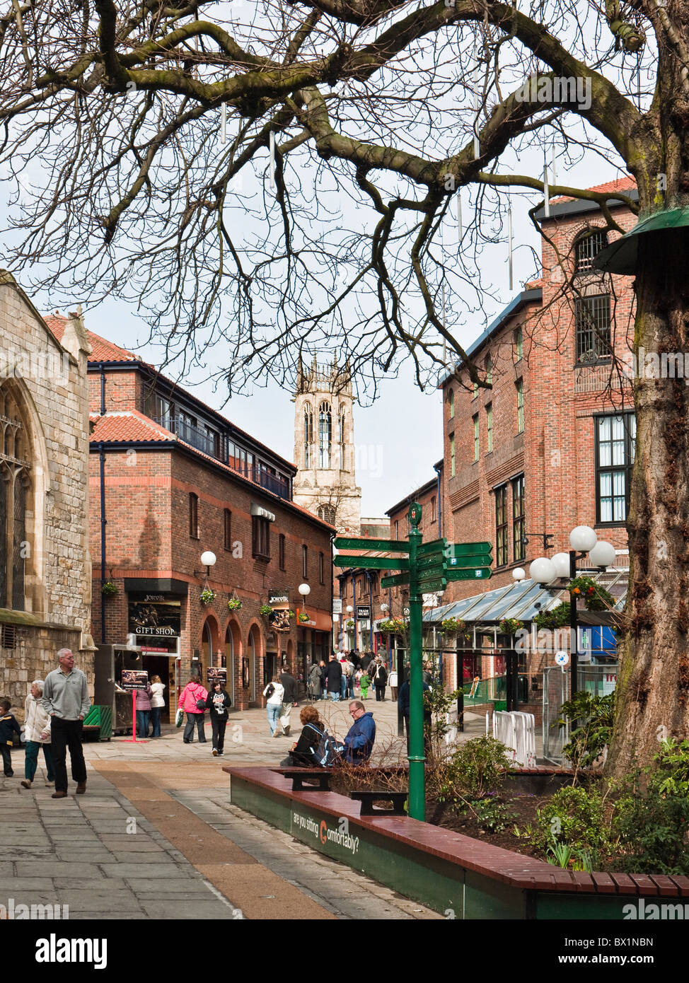 Coppergate Walk with Jorvik viking museum and signpost in winter sunshine, City of York, Yorkshire, UK Stock Photo