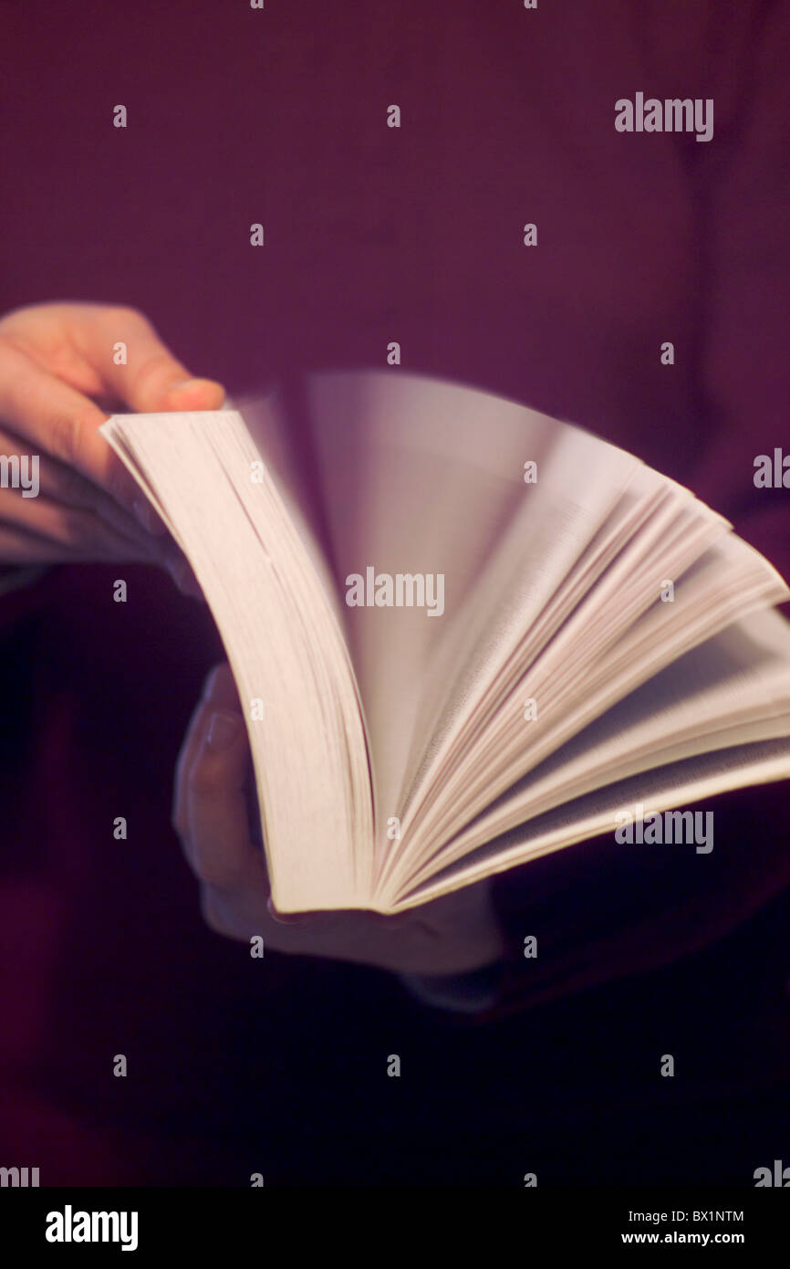 Book reading to sheets leaves paging through person hands searches