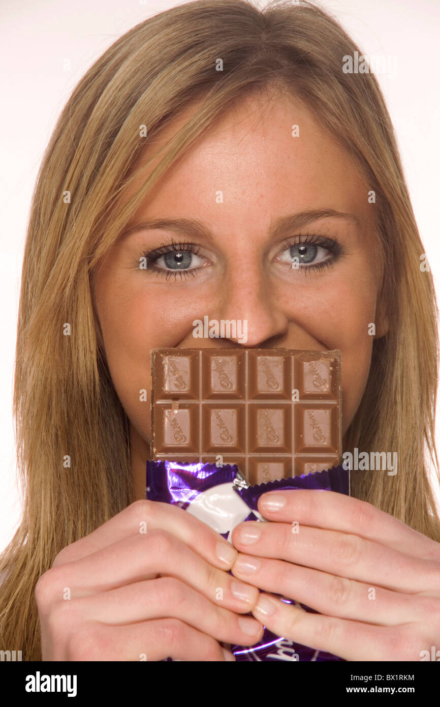 blond calories chocolate decrease diet fat food portraits sweet sweets weight Woman Stock Photo