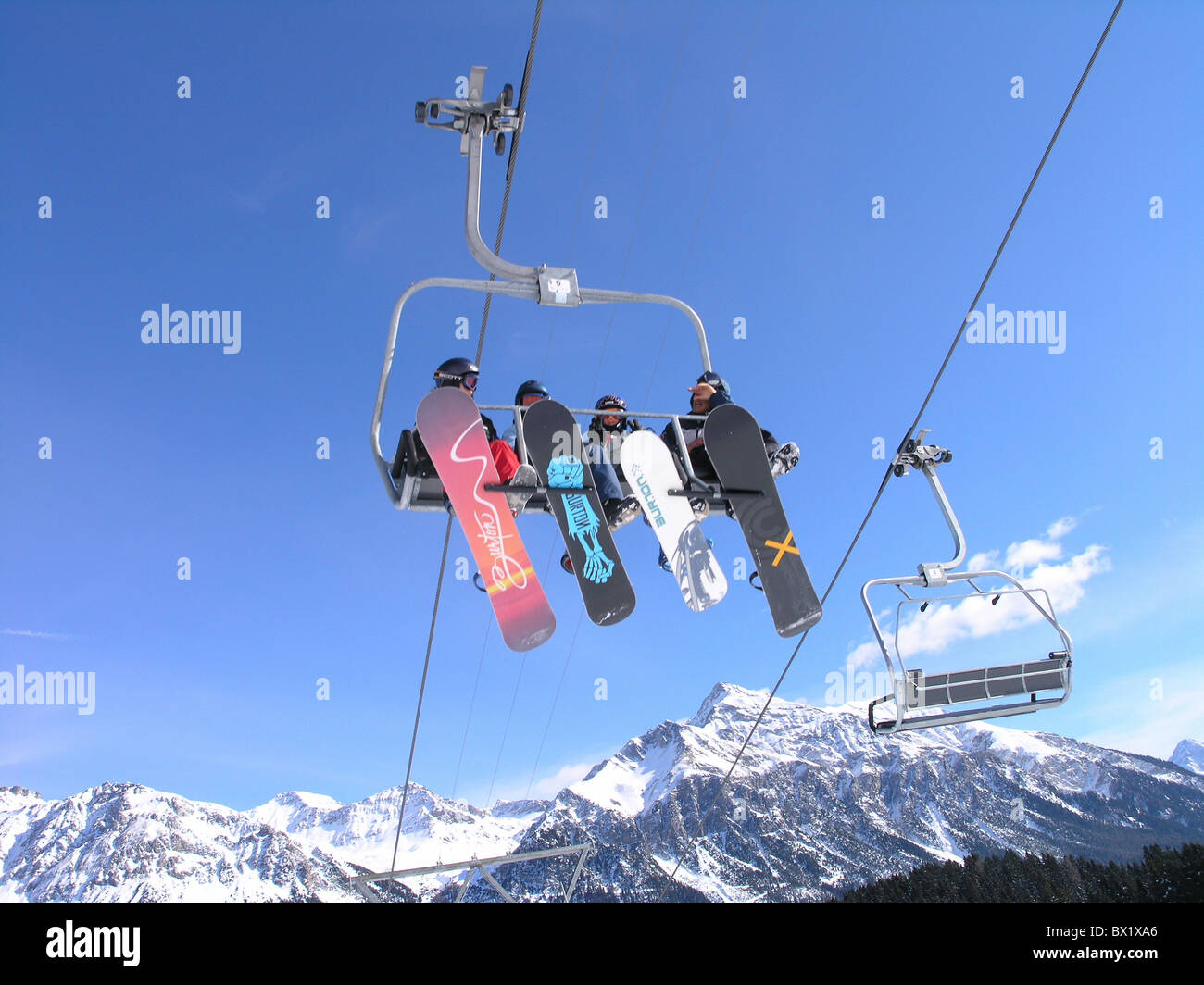 Alps chair lift cable railway chair lift Grisons Graubunden group