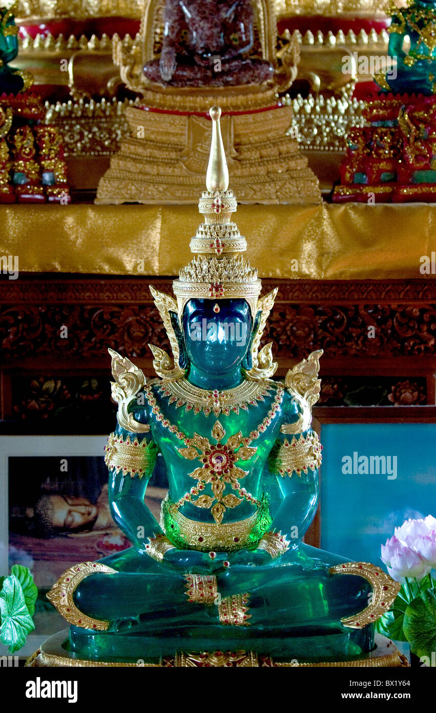 A green glass statue of Buddha in a temple in Chiang Mai in Thailand. Stock Photo