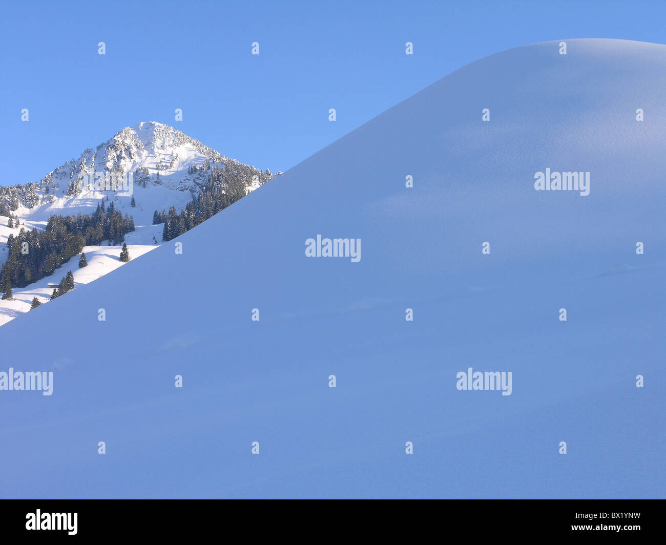 Canton Schwyz hill hilltop knoll mountains scenery landscape snow Switzerland Europe Winter Stock Photo