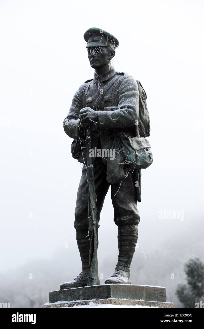 War memorial statue of a soldier covered in frost Stock Photo