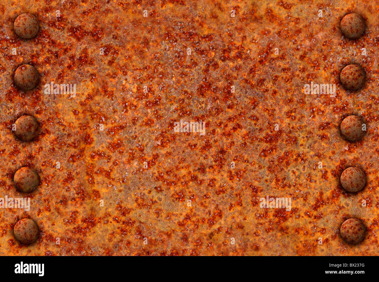 Rusted metal surface with rivet bolts seamlessly tileable Stock Photo