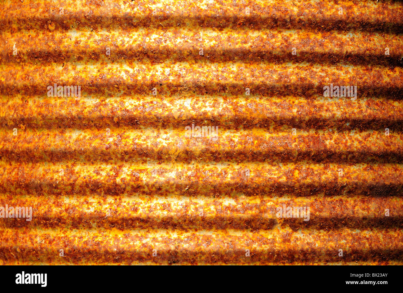 Closeup of rusty corrugated metal can surface Stock Photo