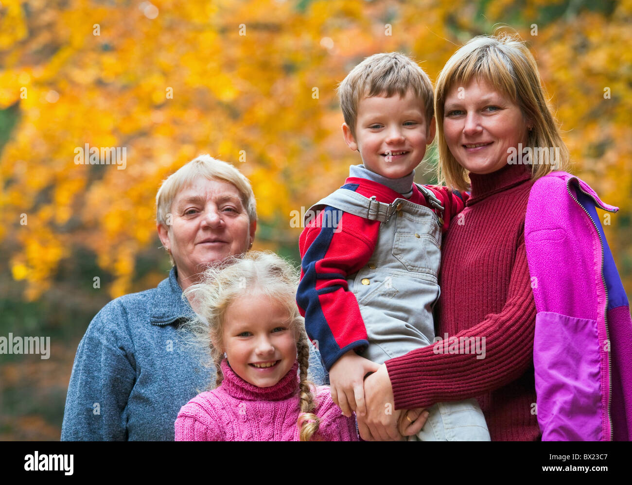 Happy family outdoor portrait in a autumn mountain walk Stock Photo - Alamy