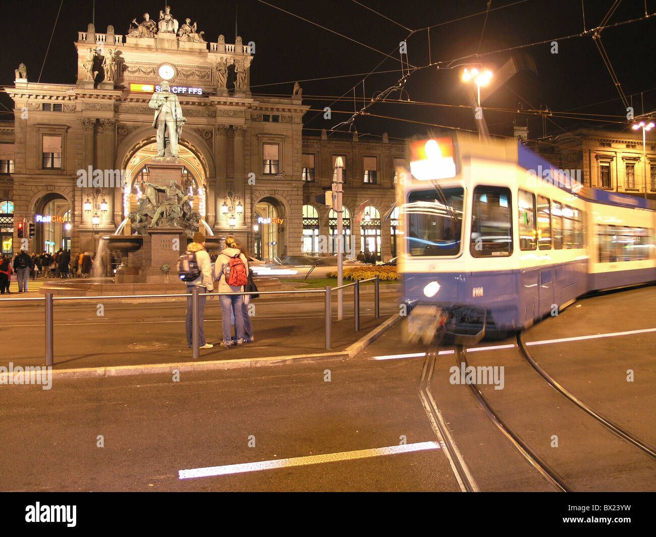 Alfred Escher monument at night central station city night Zurich person public traffic railroad railway r Stock Photo
