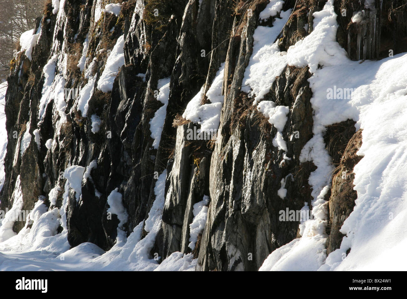 cliff ice mountains rock snow Switzerland Europe Valais winter landscape Stock Photo