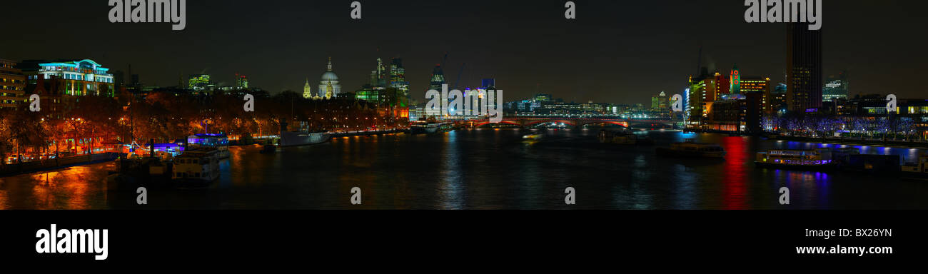 London skyline over the River Thames at night Stock Photo