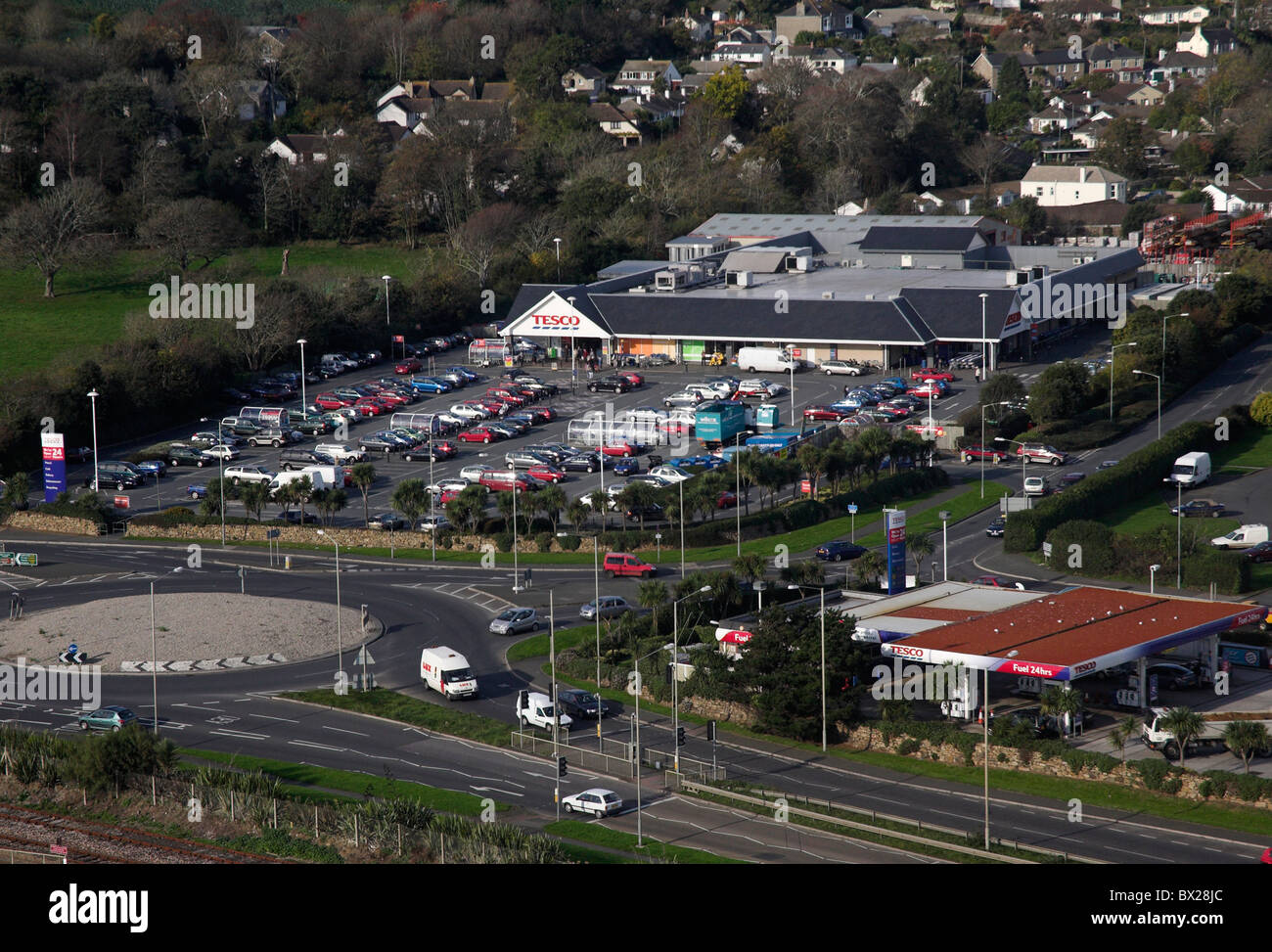 Aerial view of edge of town Tesco Superstore and Petrol station and A30