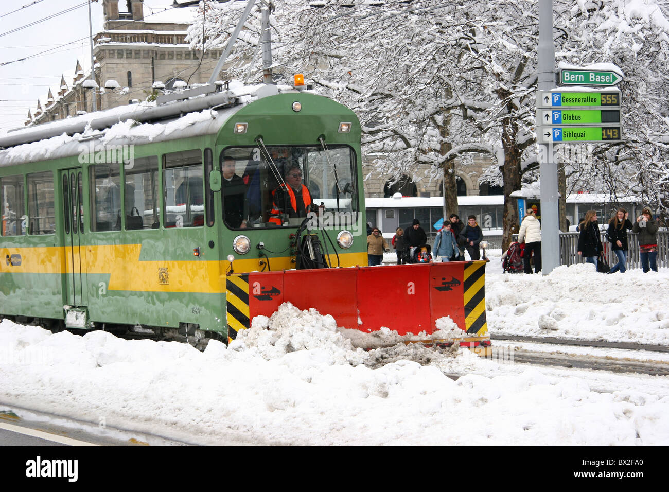 Switzerland Europe Zurich town city winter snow vehicle snowplow traffic street snow masses tram streetca Stock Photo