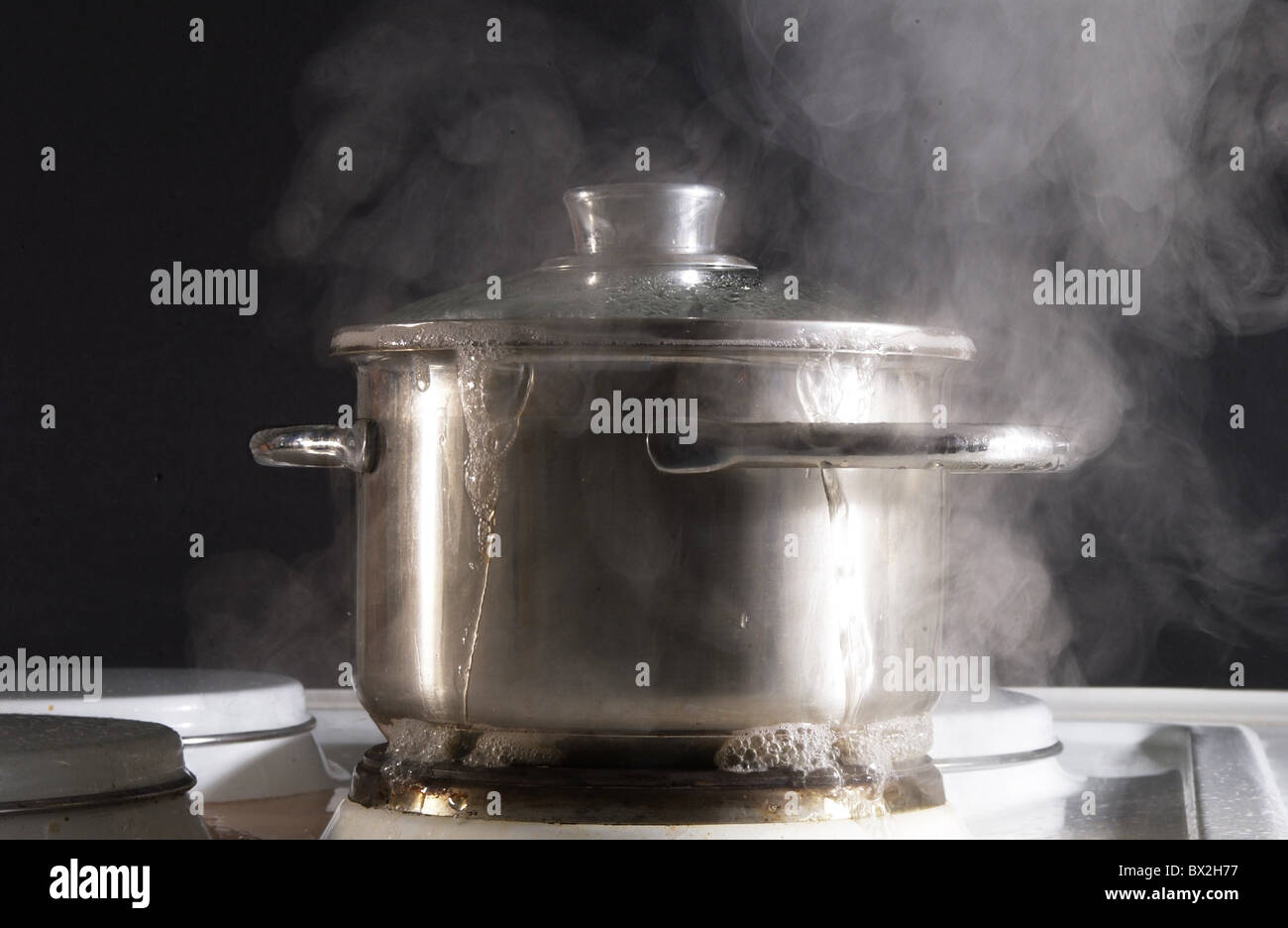 boil over boiling over cooker Cookings cuisine kitchen overrun overrunning pot problem saucepan steam st Stock Photo