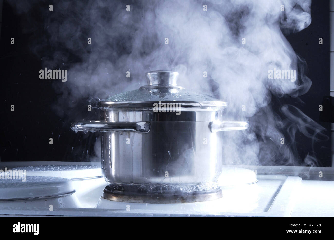 boil over boiling over cooker Cookings cuisine kitchen overrun overrunning pot problem saucepan steam st Stock Photo