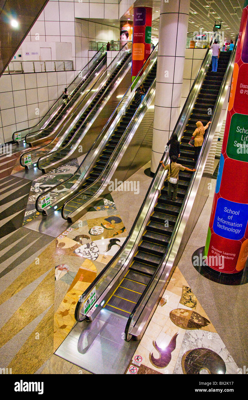 High angle view of escalators at mall in Singapore Stock Photo