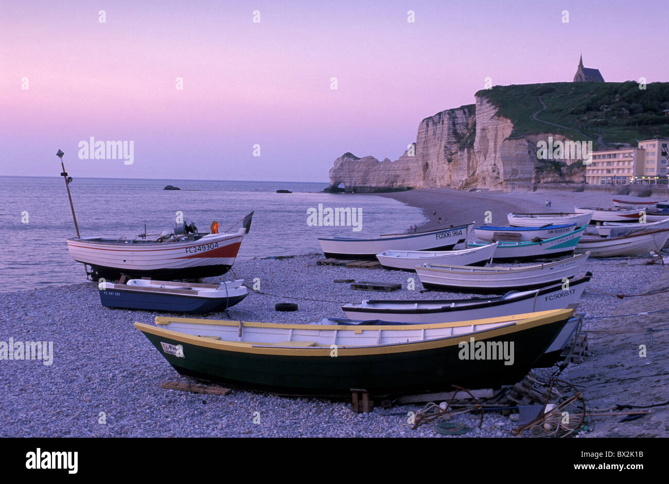 Fishing boats sea cliffs pebble beach Etretat Normandy France Europe ...