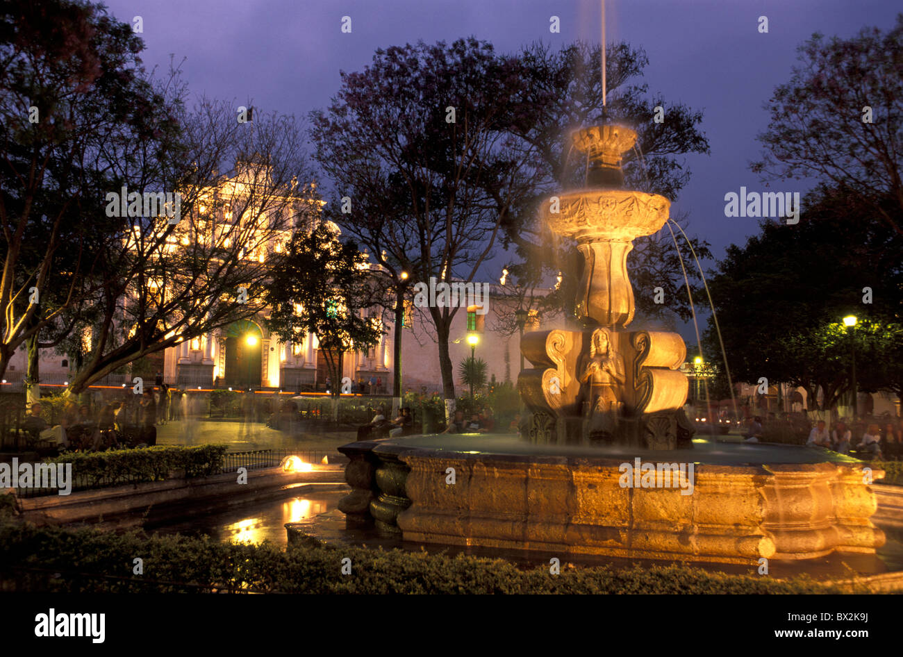 Catedral de Santiago Fountain Parque Central Antigua Guatemala Central America night illuminated well Stock Photo