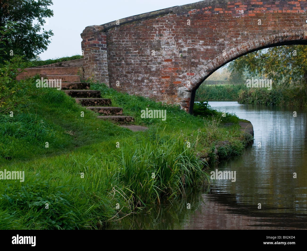 Half shot of Brick Bridge over canal showing steps from river bank and