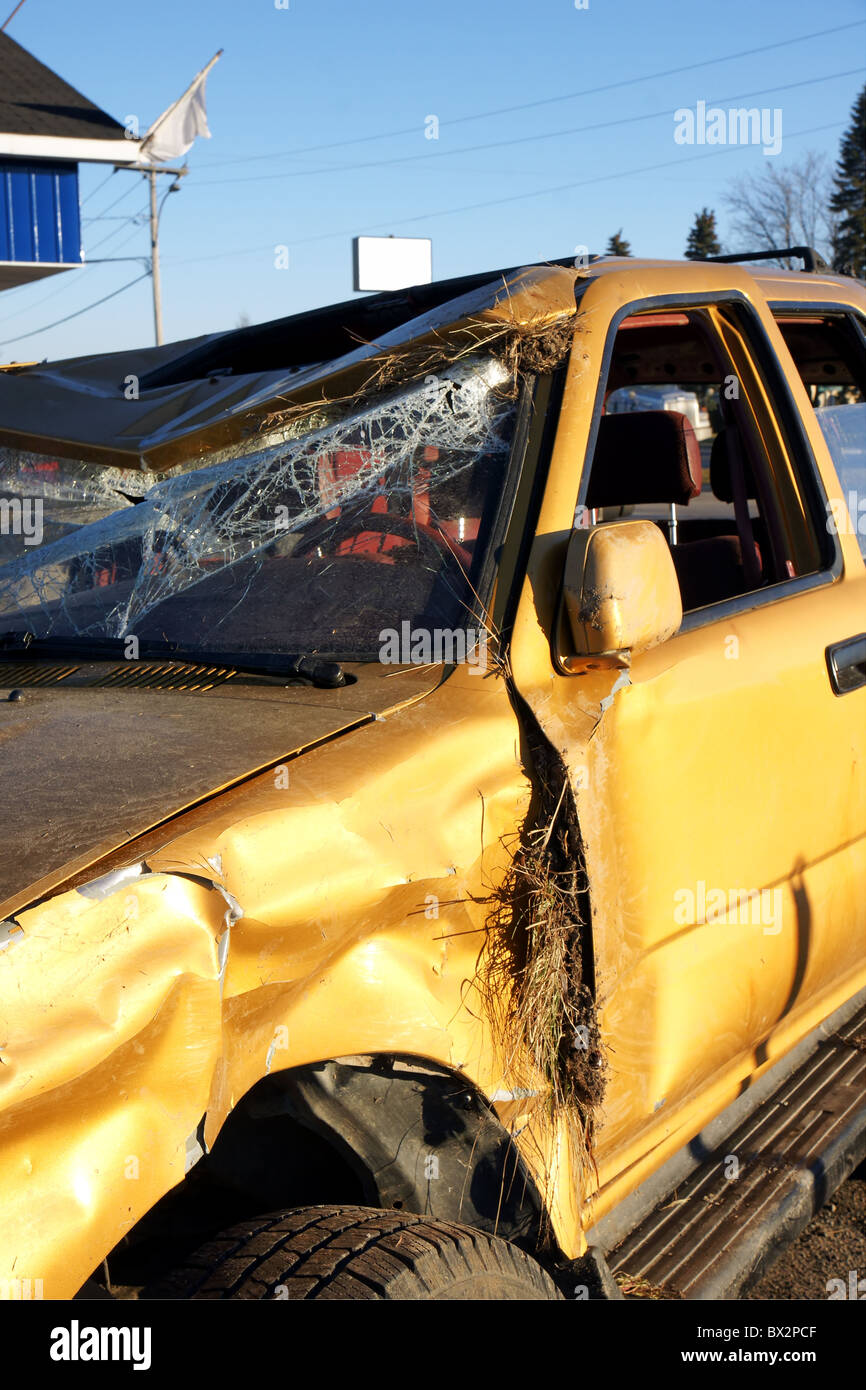 Golden SUV car crash: out of the ditch after the accident and parked outside at the garage. Stock Photo