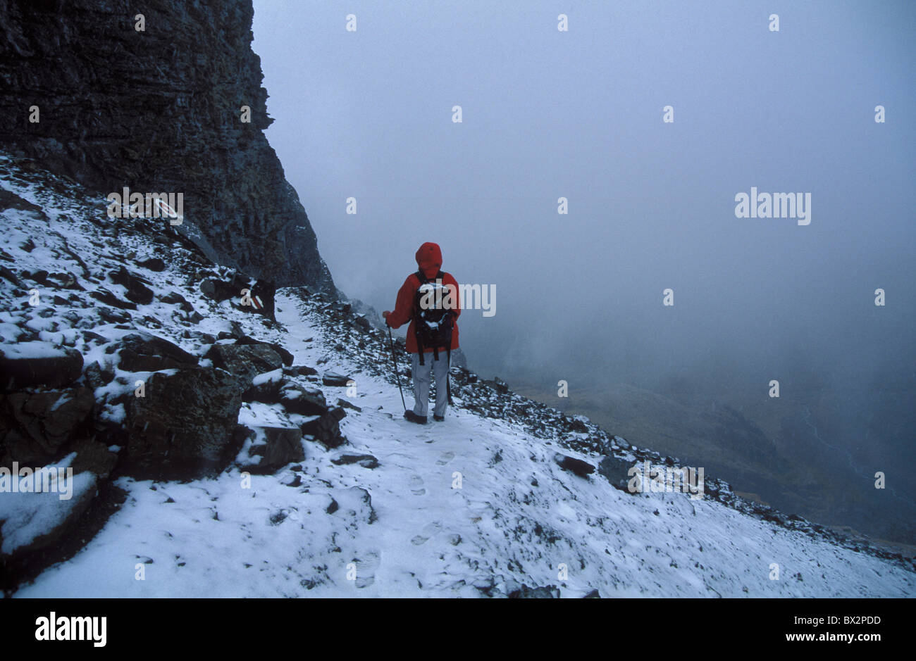 alpine Bernese Alps snow person model release hiking fog Gasterntal Gastern valley Hiker Loetschenpass Sw Stock Photo