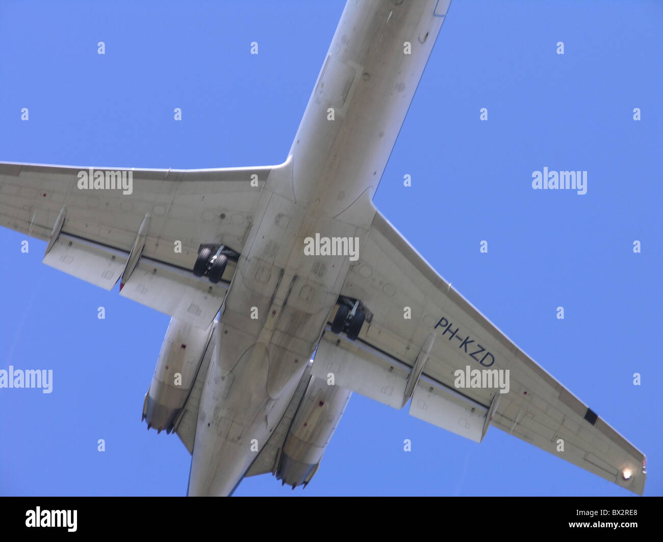 airplane Fokker 70 from below overview jet jet airplane landing sky jet jet airplane Stock Photo