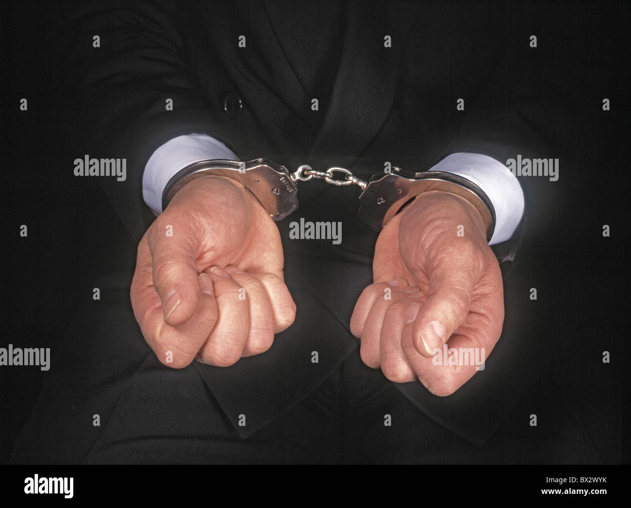Business Business Metaphors Caucasian Concepts Convicted Crime Criminal Finance Fraud Hand Hand cuffs Handc Stock Photo