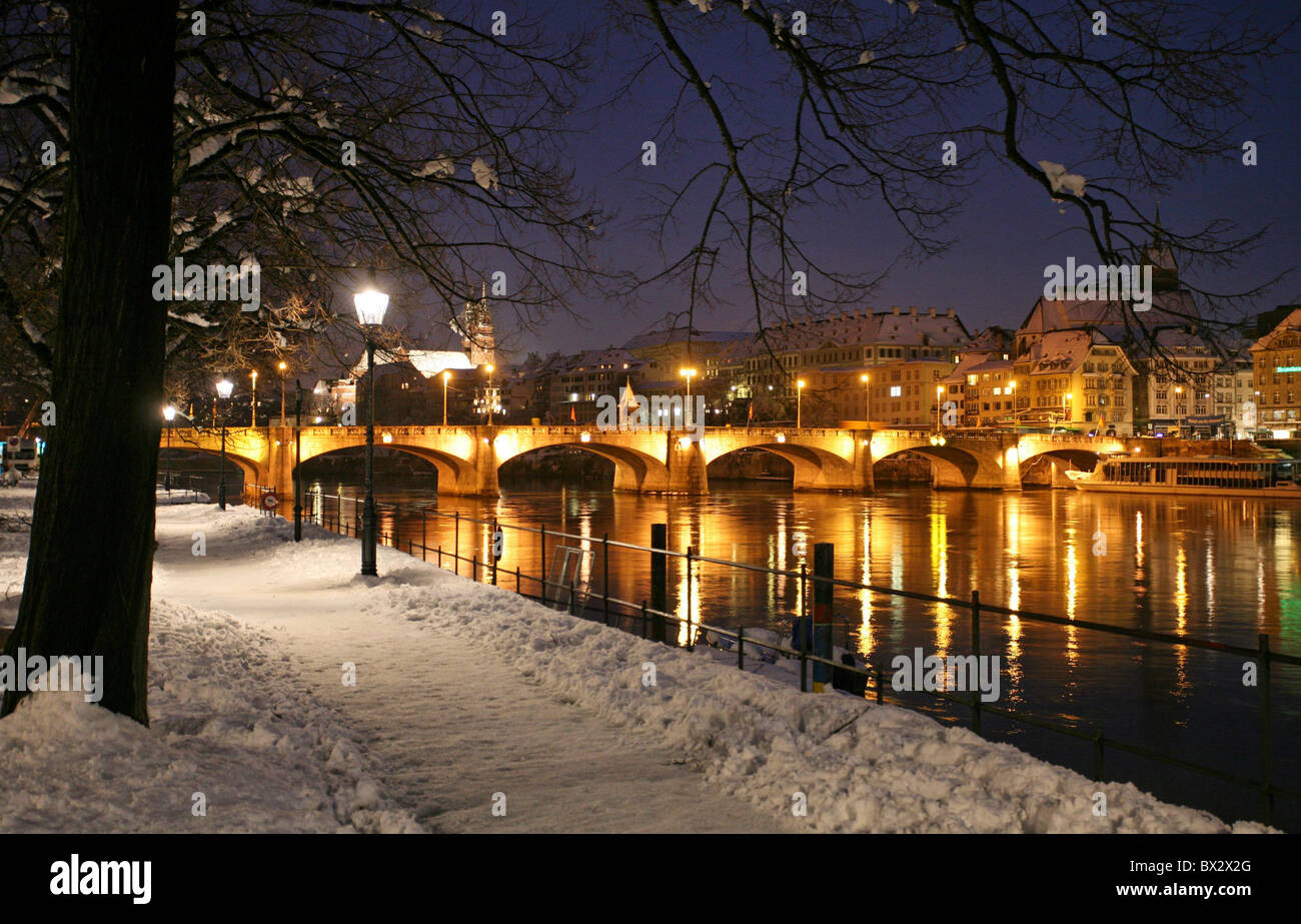 Basel Basle town city at night night winter river promenade snow Rhine Switzerland Europe Stock Photo