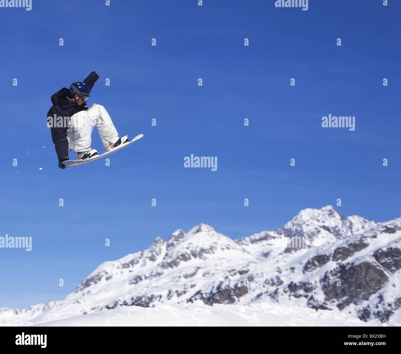 snowboard jump Engadine Furtschellas Snowboarder Upper Engadine snow winter Snowboard sports Grisons Graubu Stock Photo