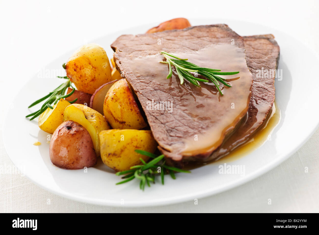 Serving of roast beef and roasted potatoes meal Stock Photo Alamy