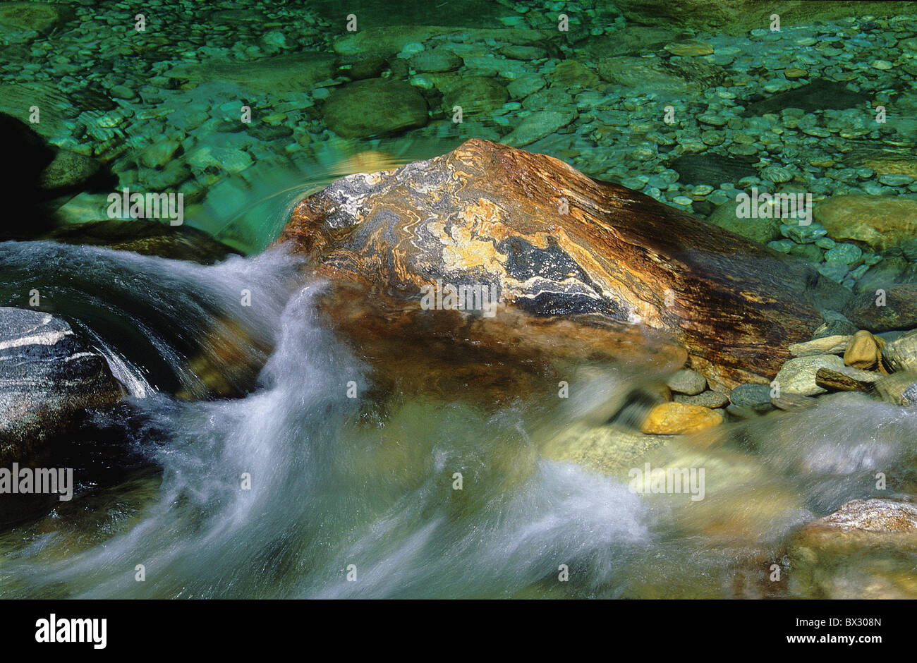 Verzasca river stones colored stones water movement reflection colored washed out erosion reflection Canton Stock Photo